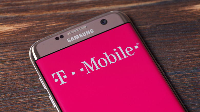 An old Samsung smartphone showing t-mobile logo on the display