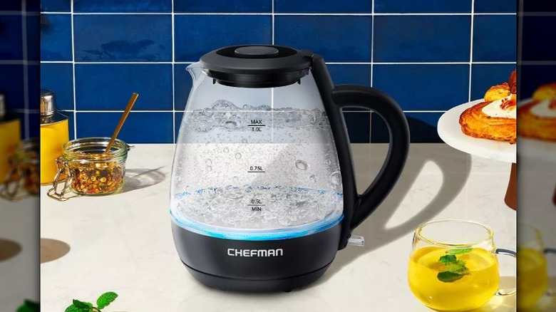 Electric kettle boiling water in a kitchen