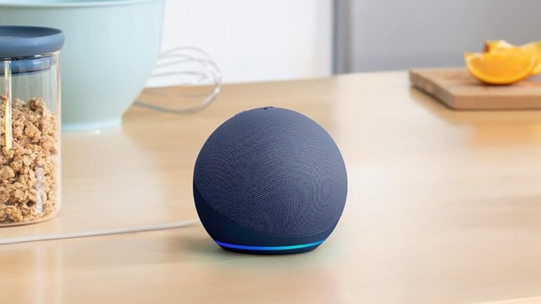 Blue Amazon Echo Dot placed on a kitchen counter