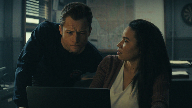 Taron Egerton and Jurnee Smollett in "Smoke"