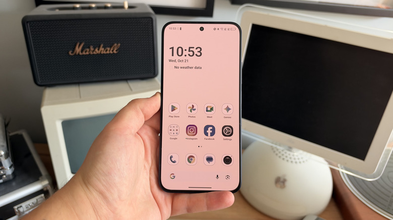 TCL P80 Ultra being held in one hand with Paper Mode enabled on the display