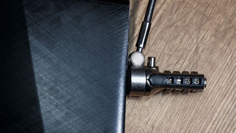 close-up of screw-like kensington lock in the side of a laptop showing a combination system