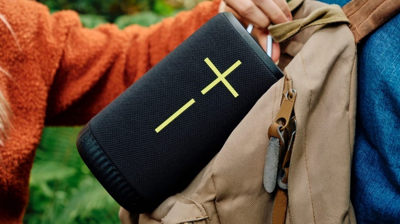 the Ultimate Ears Everboom hanging from a backpack