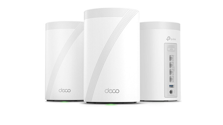 3-pack of the TP-Link Deco 7 Pro BE63 next to each other with back ports shown
