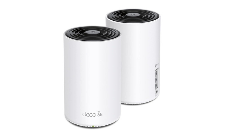 A pair of TP-Link Deco AXE5400 next to each other with USB ports shown on the back