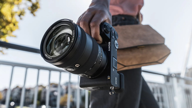 A person holding a Sony a6700 camera