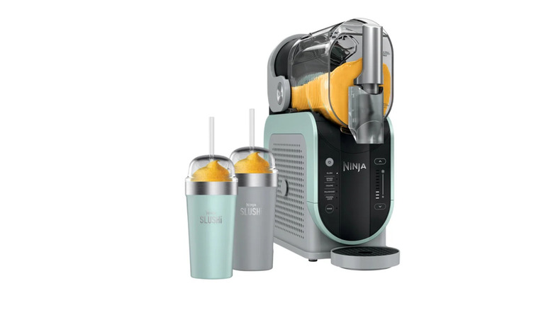 Ninja Slushi machine next to two Bubble Cups with frozen liquid