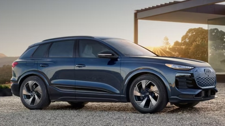 Audi Q6 E-Tron electric vehicle parked on a gravel driveway