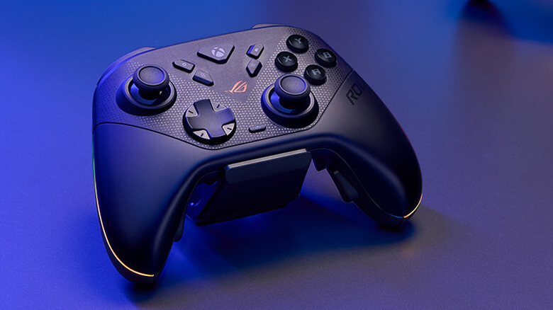 The ASUS ROG Raikiri II controller, placed on a table bathed in blue light