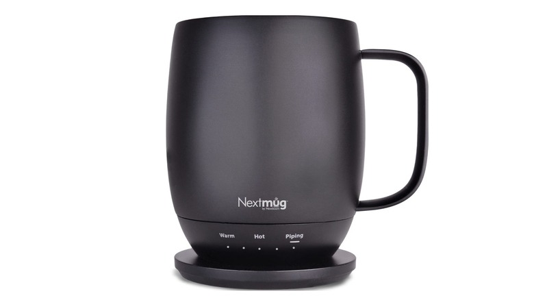 The Nextmug self-heating coffee mug on its charging coaster against a white background.