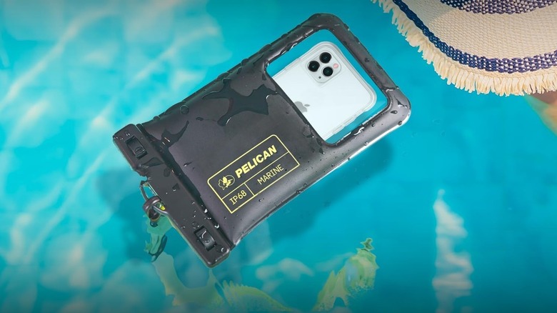 Pelican Marine IP68 Waterproof Phone Pouch floating on the water with an iPhone inside