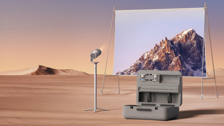 MoGo 4 Laser Outdoor Collection Portable Projector set up in a vast desert