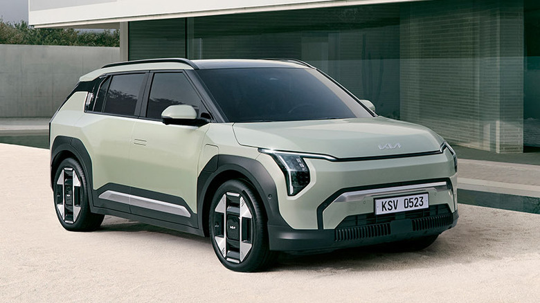 Kia EV3 parked in front of a modern house