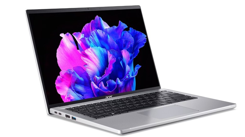 The Acer Swift Go 14 laptop with a colorful image on the screen, on a white background.