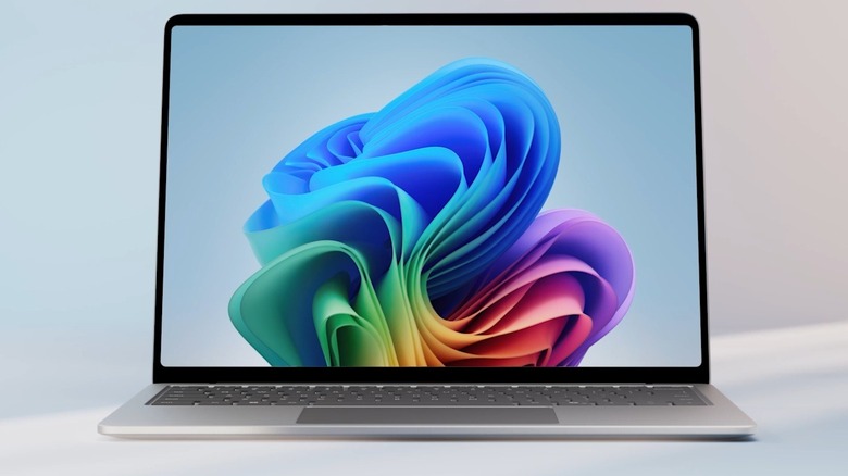 The Microsoft Surface Laptop 7 with a colorful image on the screen.