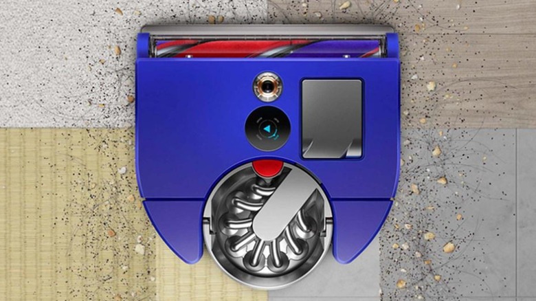 The top view of the Dyson 360 Vis Nav robotic vacuum while cleaning different floor types.