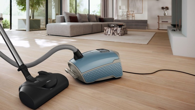 The Miele Guard L1 canister vacuum in a living room.