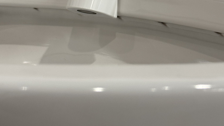 The Throne toilet bowl camera sitting on the side of a toilet