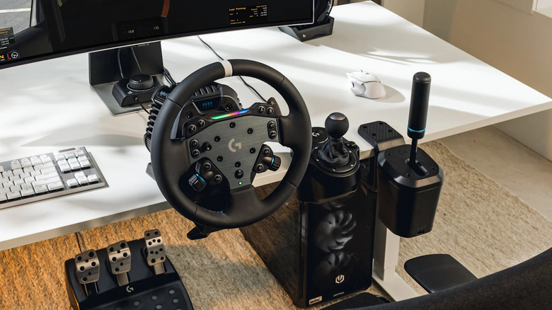 The Logitech G RS50 attached to a desk with a PC set up