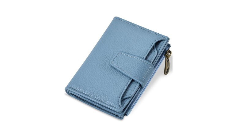 A blue women's wallet that has a zipper