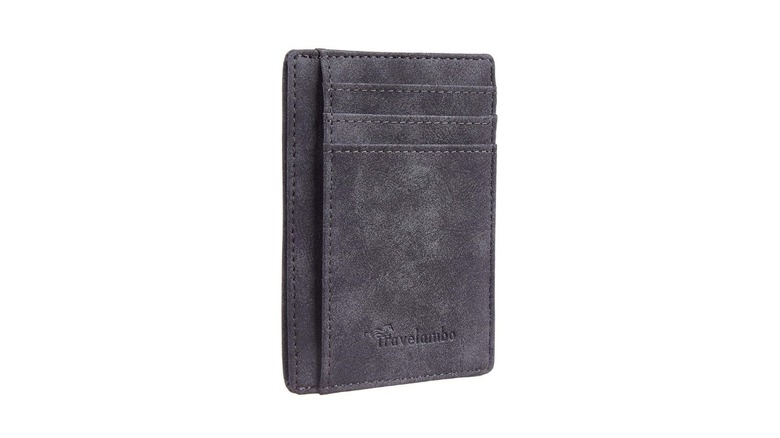 A thin leather wallet colored gray with Travelambo written on the bottom of its front
