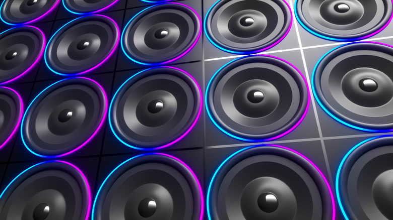 A 3D render of a wall covered in subwoofers