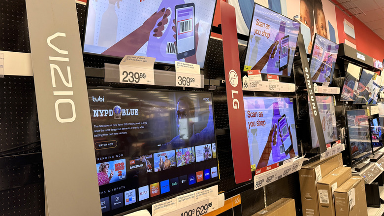TVs on display in a Walmart store