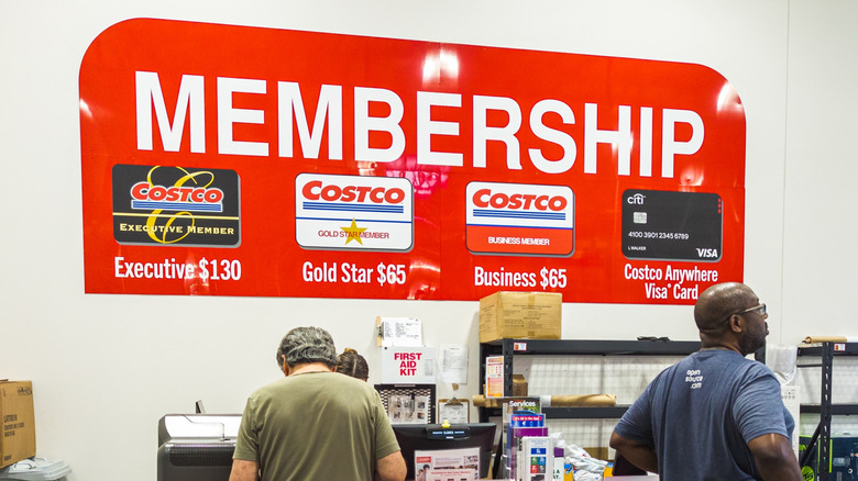 Close up of Costco membership sign in store.