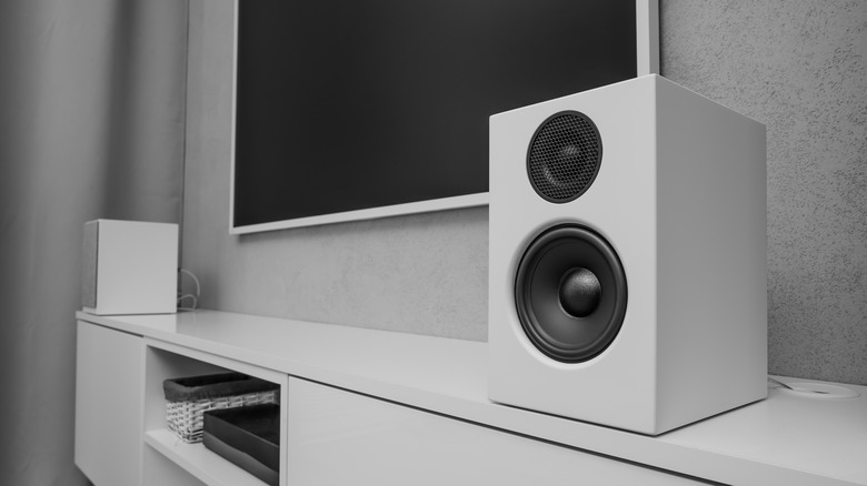 Home speakers near TV on entertainment console