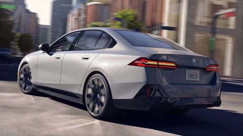A BMW i5 electric luxury sedan on a city street