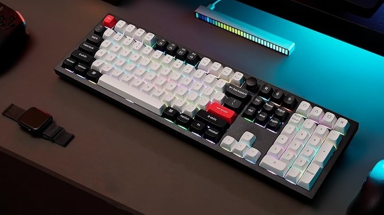 Keychron Q6 HE pictured on desk with white and black keycaps