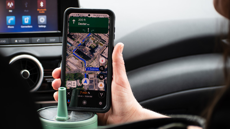 Google Maps on a smartphone inside a vehicle