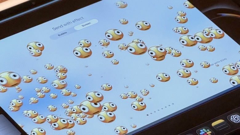 An iPad display with several distorted face emojis