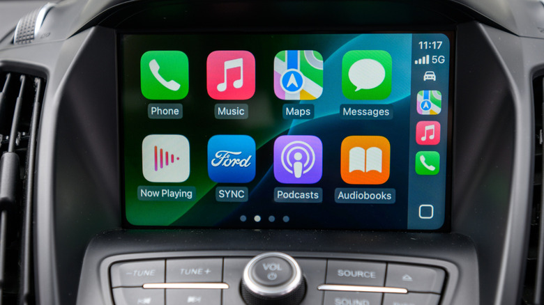 An image of a vehicle's infotainment screen displaying the Apple CarPlay Home screen