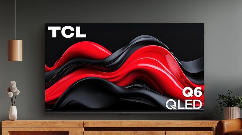 The TCL Q651G wall-mounted in a modern living room