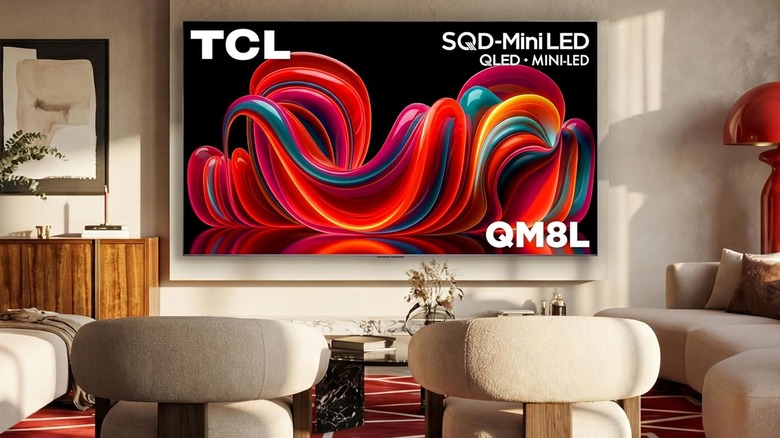 The TCL QM8L wall-mounted in a modern living room