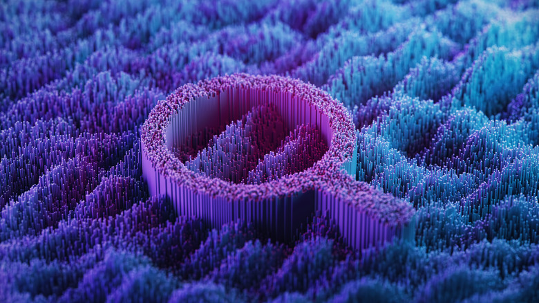 Magnifying glass on an abstract digital landscape.