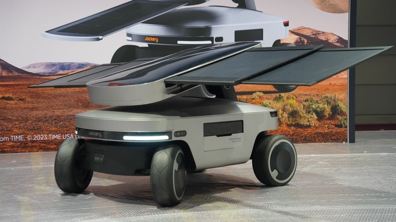 Jackery Solar Mars Bot on the floor with a graphic featuring it in the background