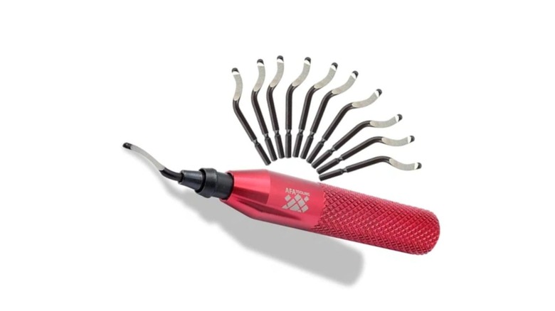 AFA deburring tool with a red handle and replacement blades.