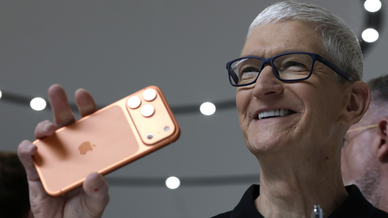 Apple's CEO Tim Cook holding the new iPhone 17 Pro Max