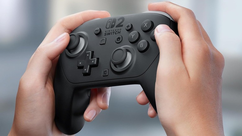 Hands holding a Switch 2 Pro Controller