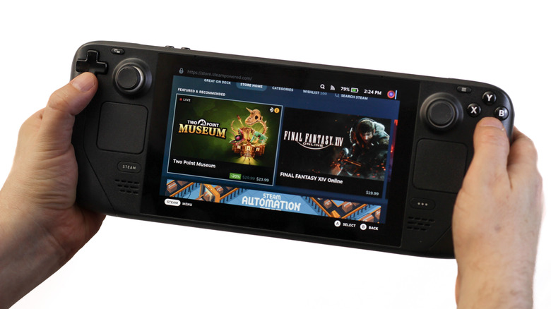 Steam Deck handheld gaming PC showing the Steam store while held in both hands.