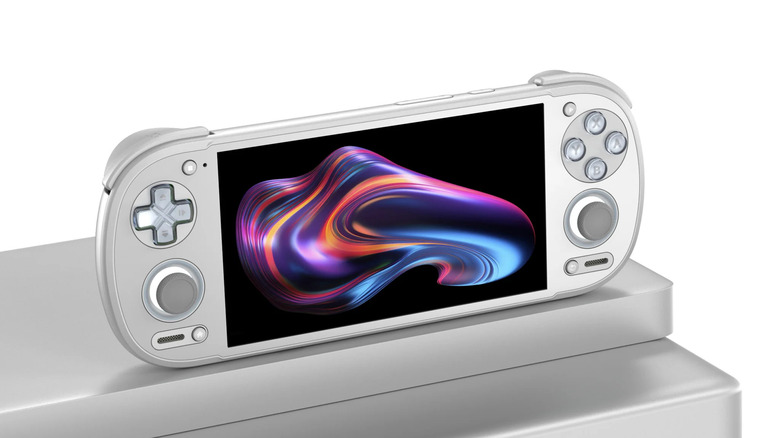 Retroid Pocket 6 handheld gaming device displayed on a silver stand with a colorful image on screen.