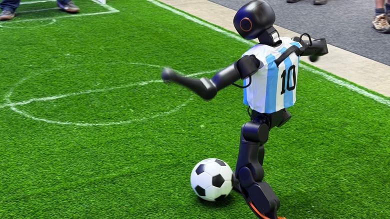 Humanoid robot kicking a soccer ball