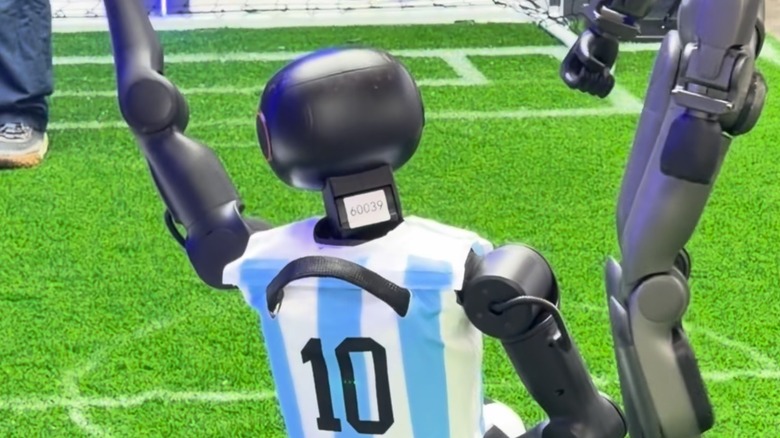 Humanoid robot celebrating goal