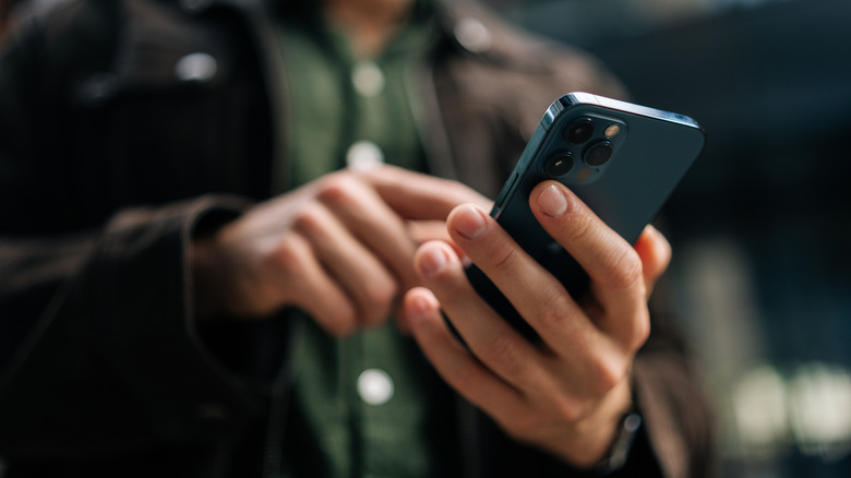 A person using an iPhone.