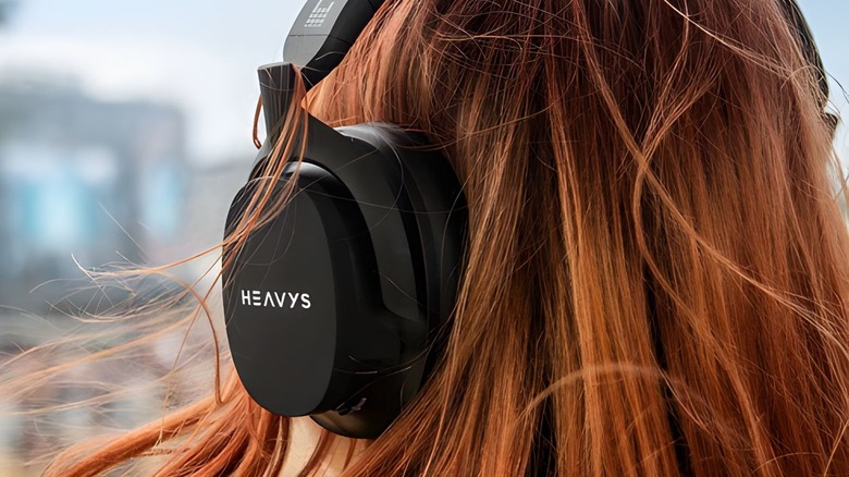 A rear shot of a red-haired person wearing Heavys H1H