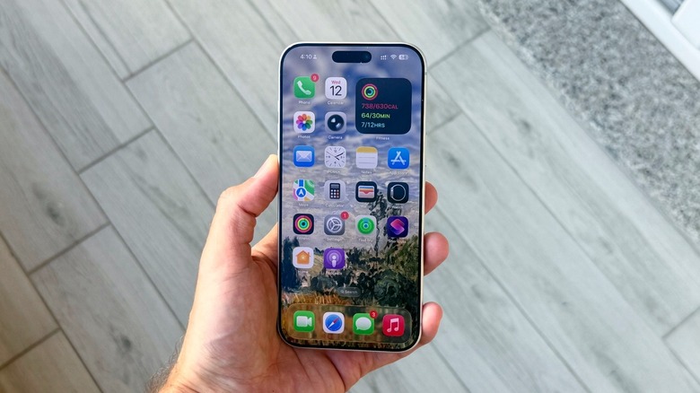 A hand holding an iPhone