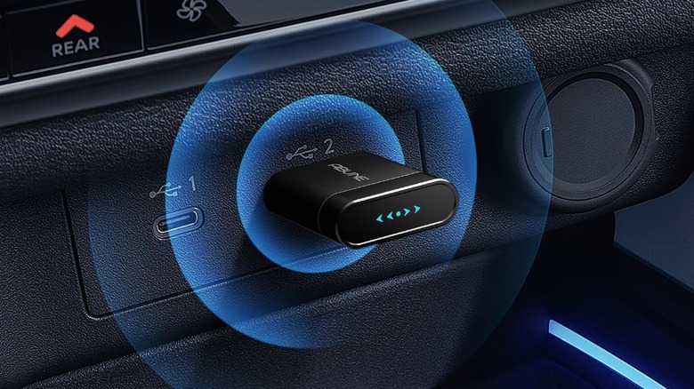 Abune Mini Wireless Adapter connected to a USB port in a car