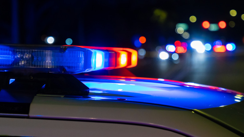 Blue and red lights flashing on a patrol car